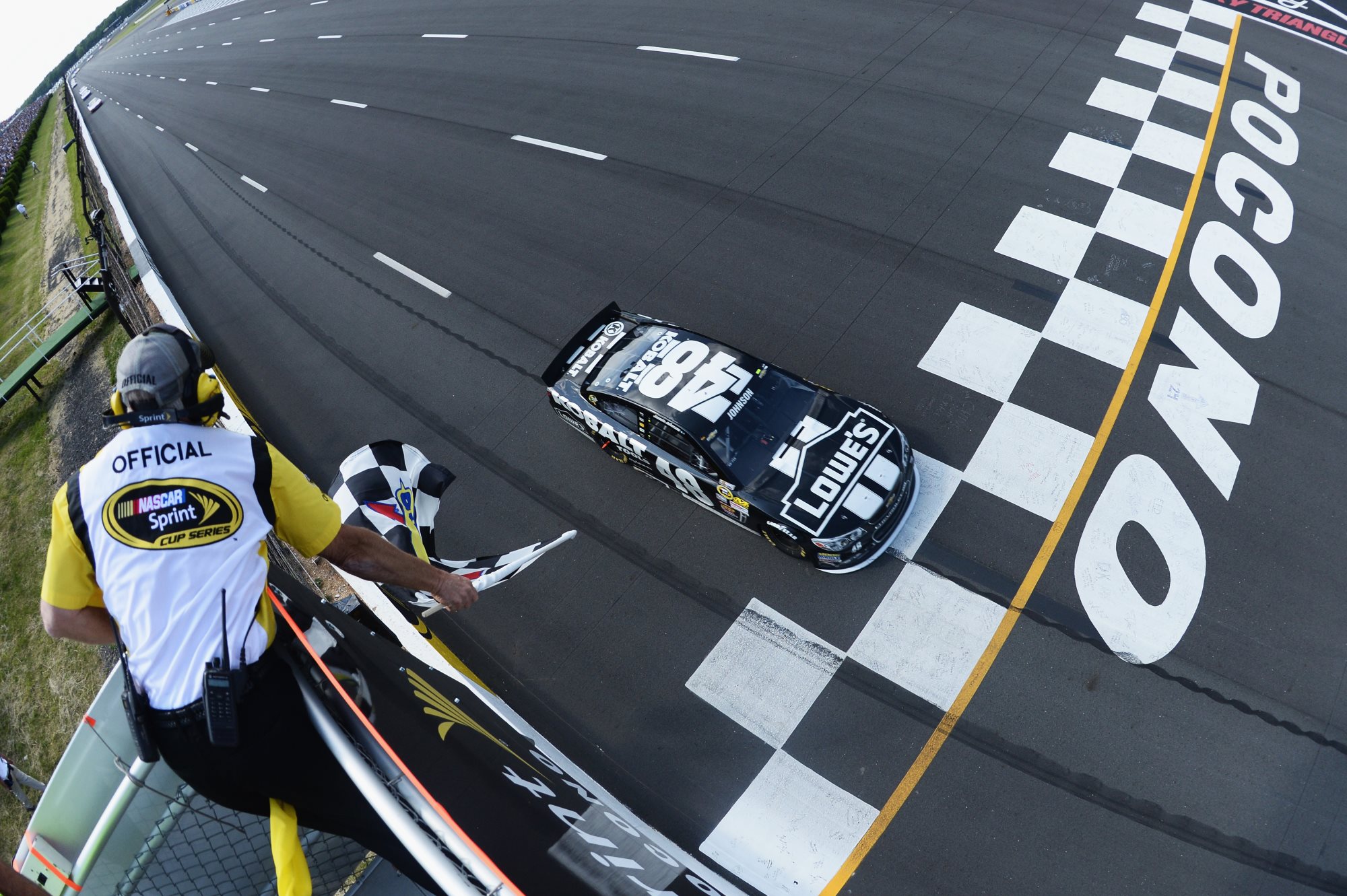 Jimmie_Johnson_Win_Flag_Pocono_NSCS_060913