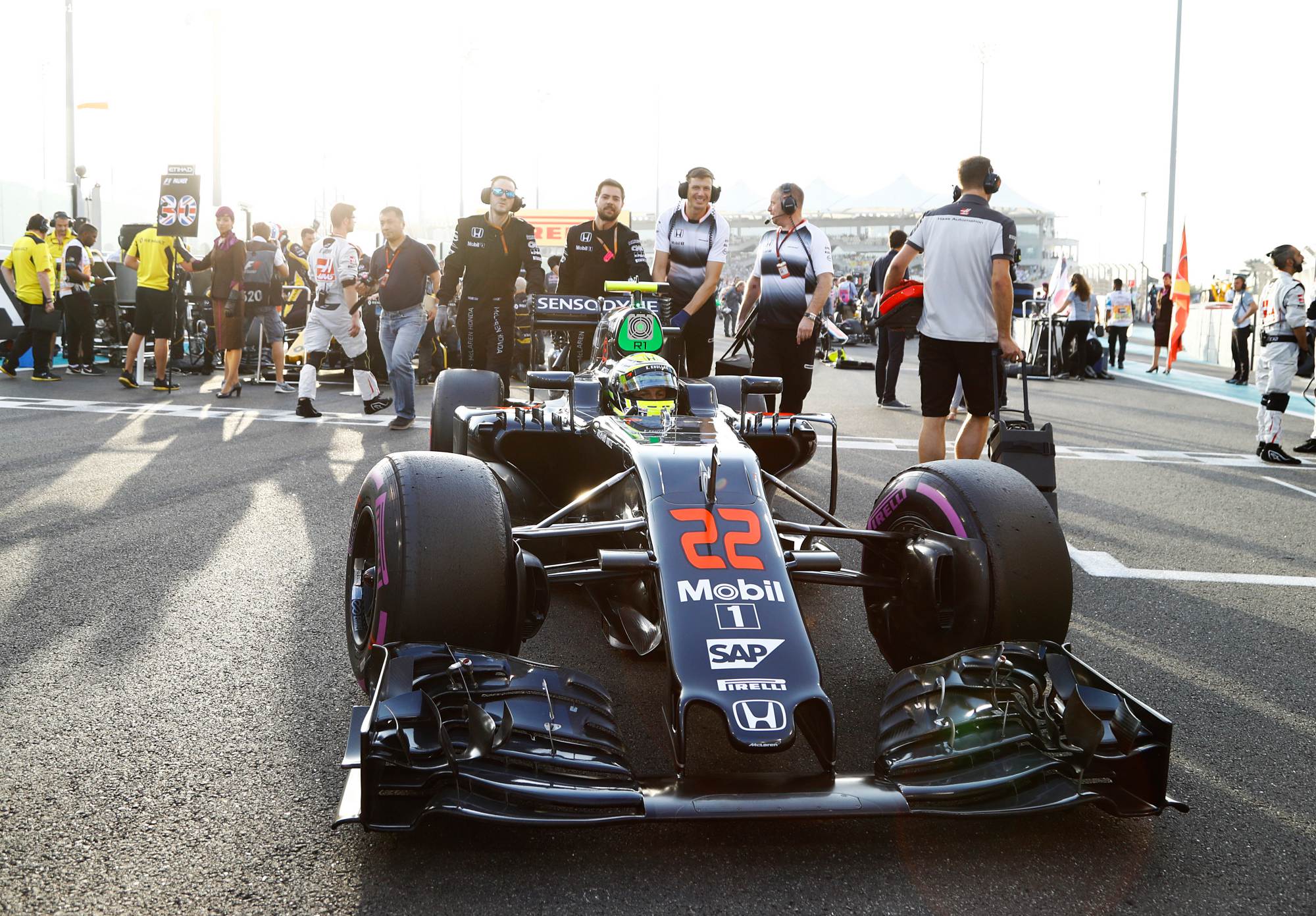 Jenson Button arrives on the grid.