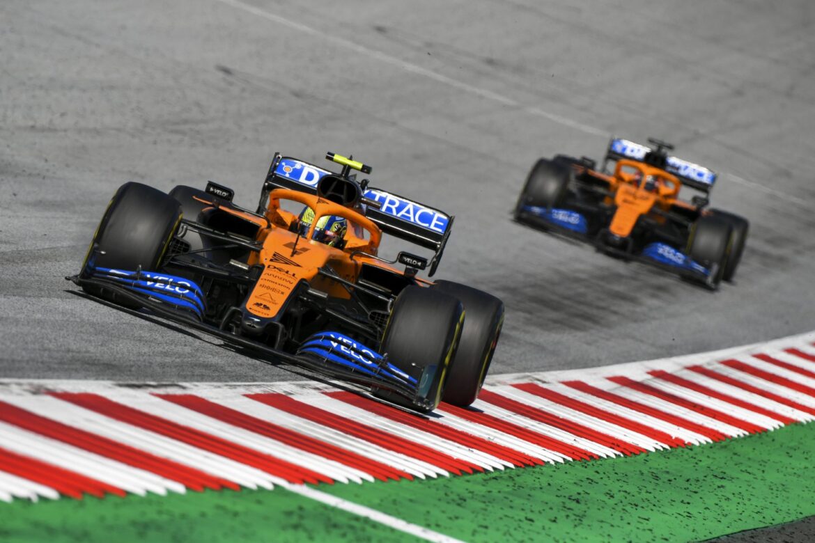 Lando Norris, McLaren MCL35, leads Carlos Sainz, McLaren MCL35