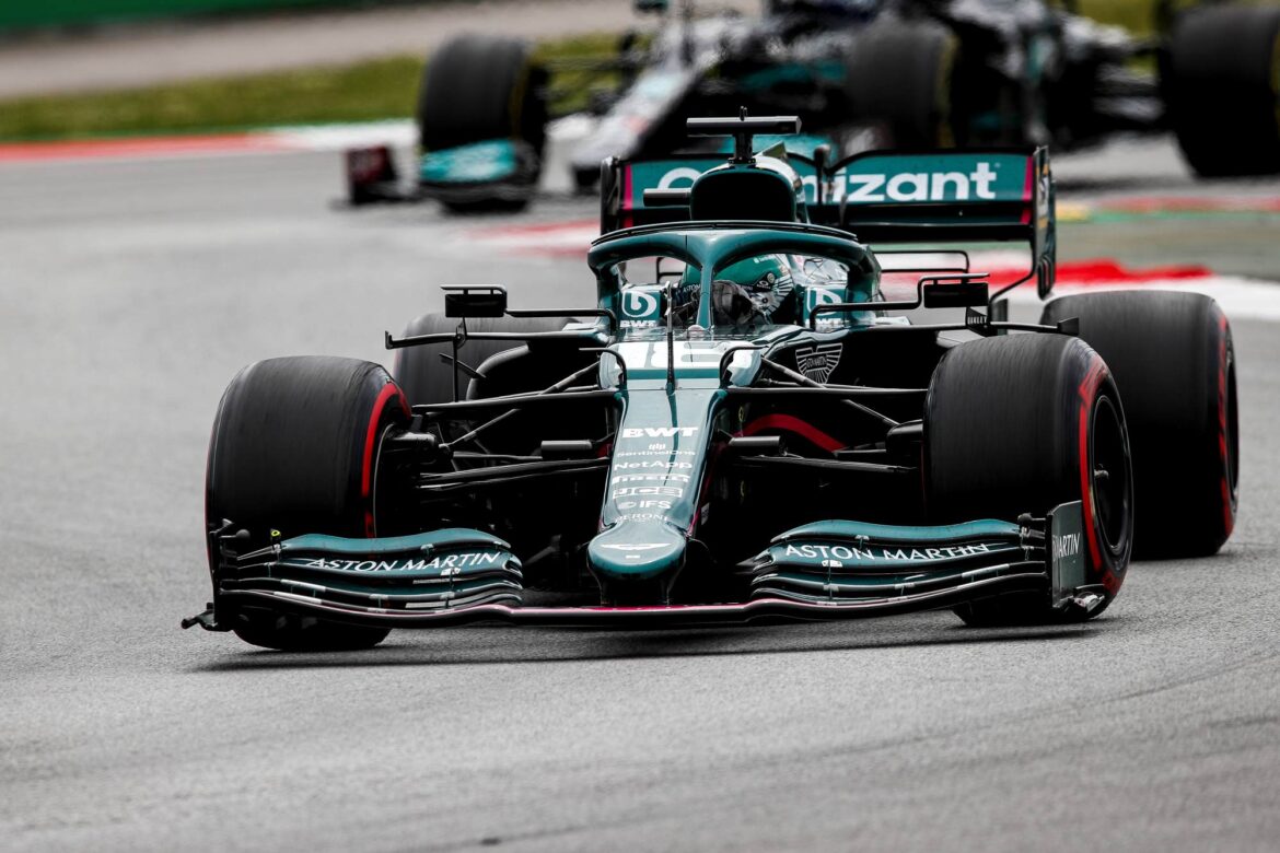 Lance Stroll, Aston Martin AMR21, leads Valtteri Bottas, Mercedes W12