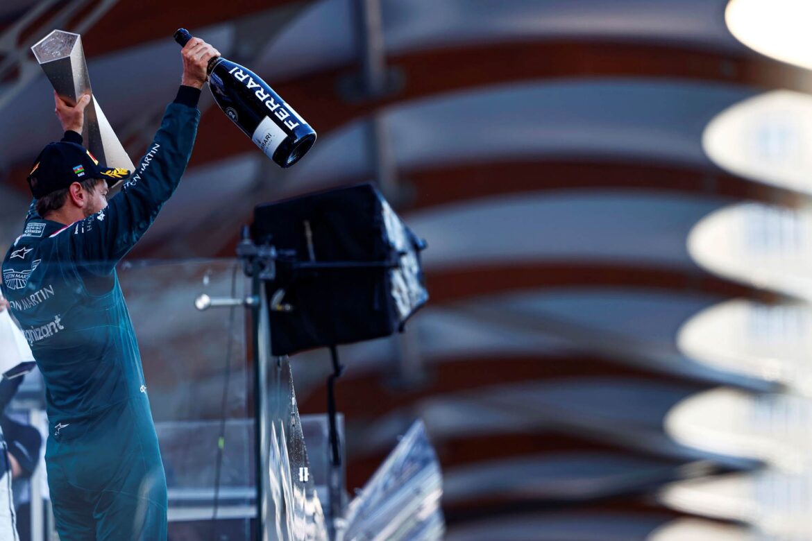 Sebastian Vettel, Aston Martin, 2nd position, with his trophy and Champagne
