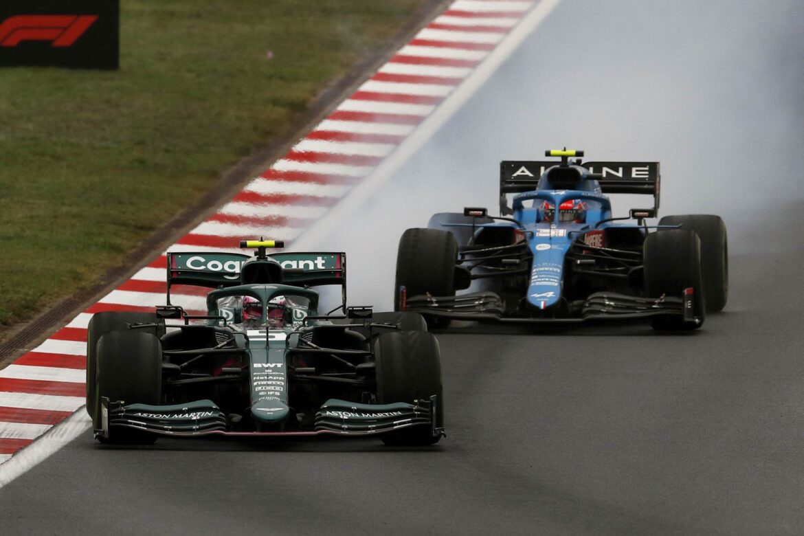 Sebastian Vettel, Aston Martin AMR21, leads Esteban Ocon, Alpine A521