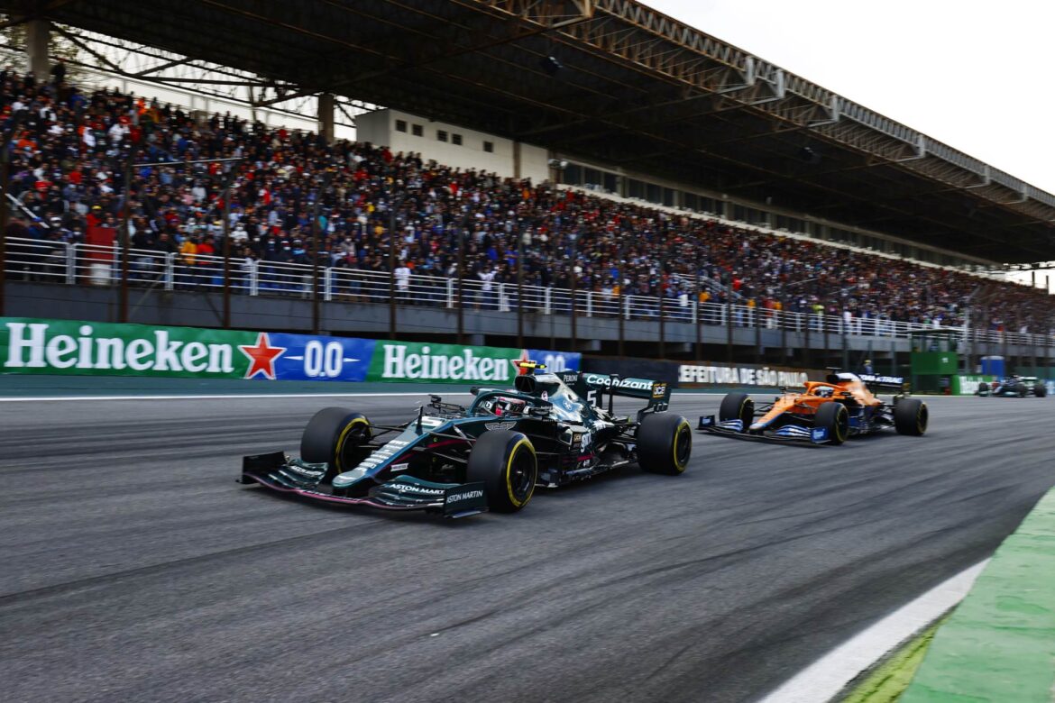 Sebastian Vettel, Aston Martin AMR21, leads Daniel Ricciardo, McLaren MCL35M