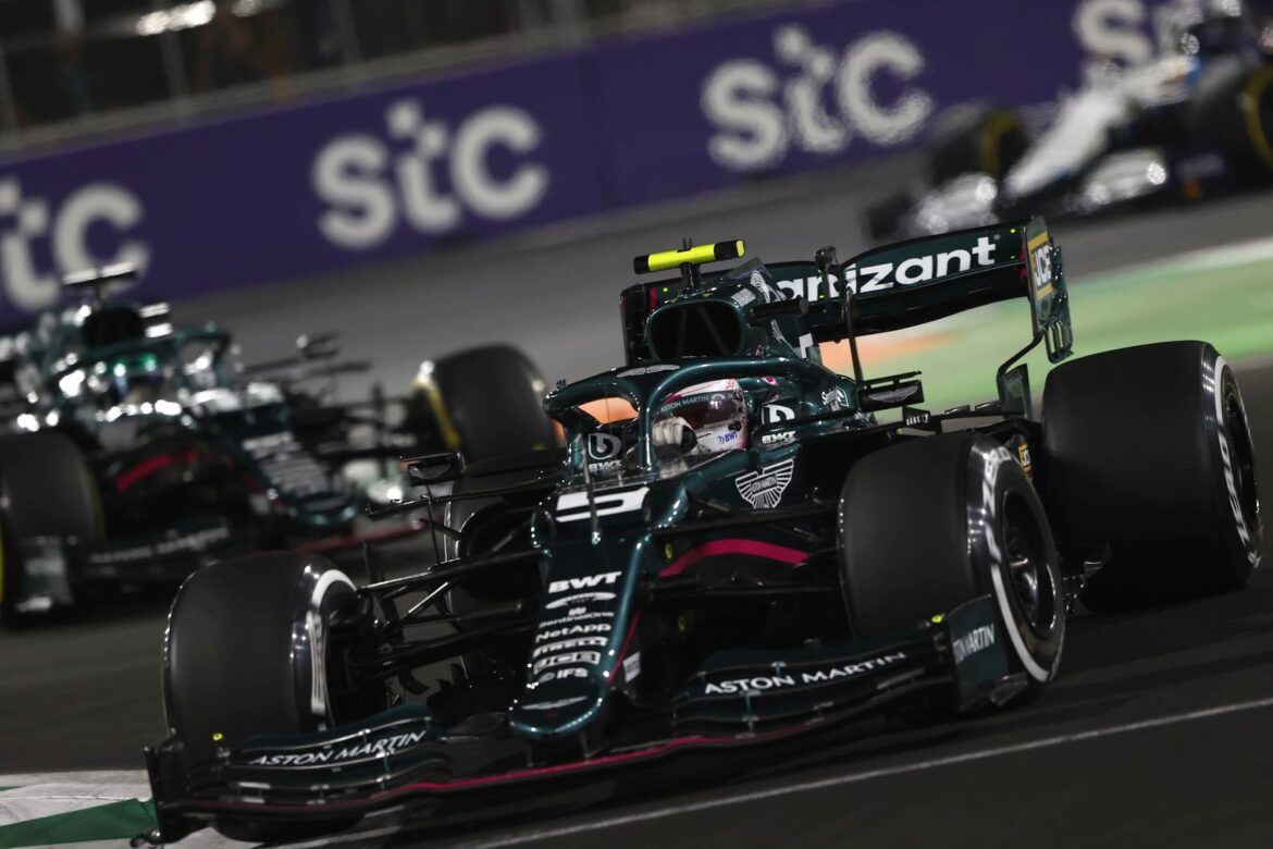 Sebastian Vettel, Aston Martin AMR21, leads Lance Stroll, Aston Martin AMR21