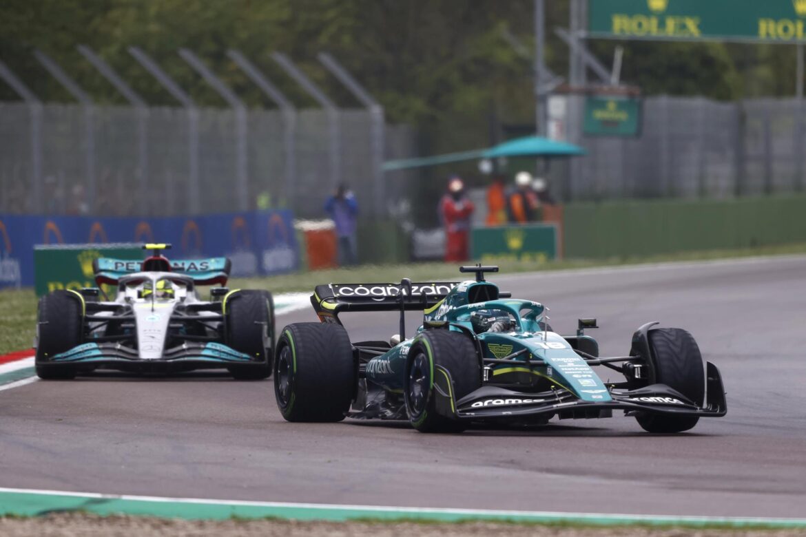 Lance Stroll, Aston Martin AMR22, leads Sir Lewis Hamilton, Mercedes W13