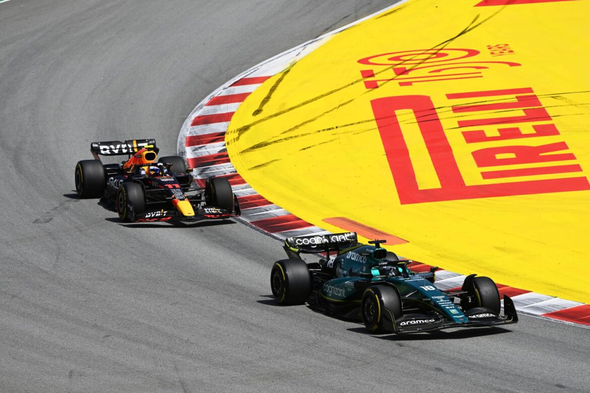 Lance Stroll, Aston Martin AMR22, leads Sergio Perez, Red Bull Racing RB18