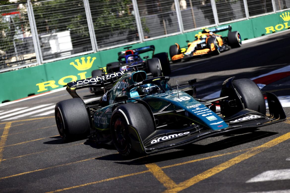 Lance Stroll, Aston Martin AMR22, leads Alex Albon, Williams FW44