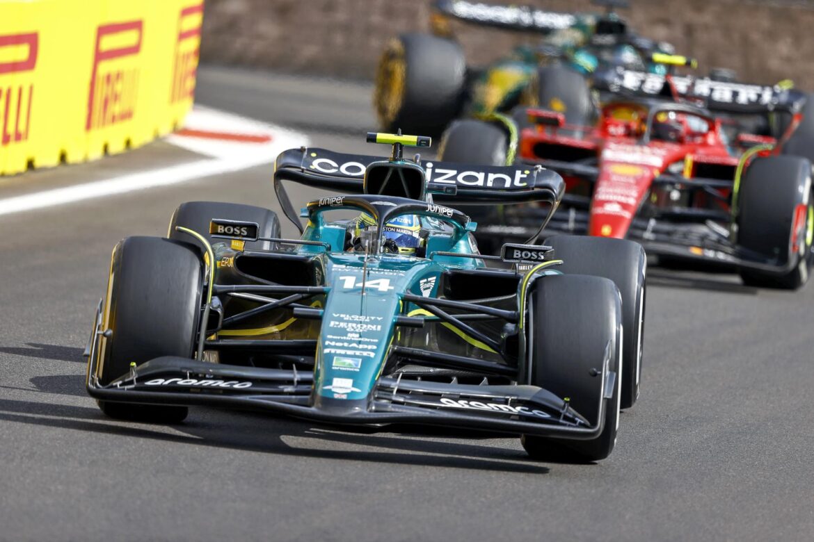 Fernando Alonso, Aston Martin AMR23, leads Carlos Sainz, Ferrari SF-23