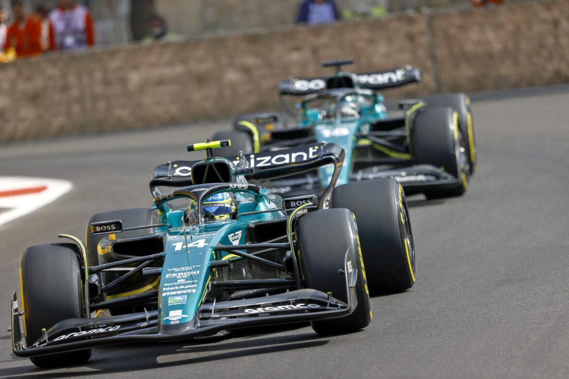 Fernando Alonso, Aston Martin AMR23, leads Lance Stroll, Aston Martin AMR23