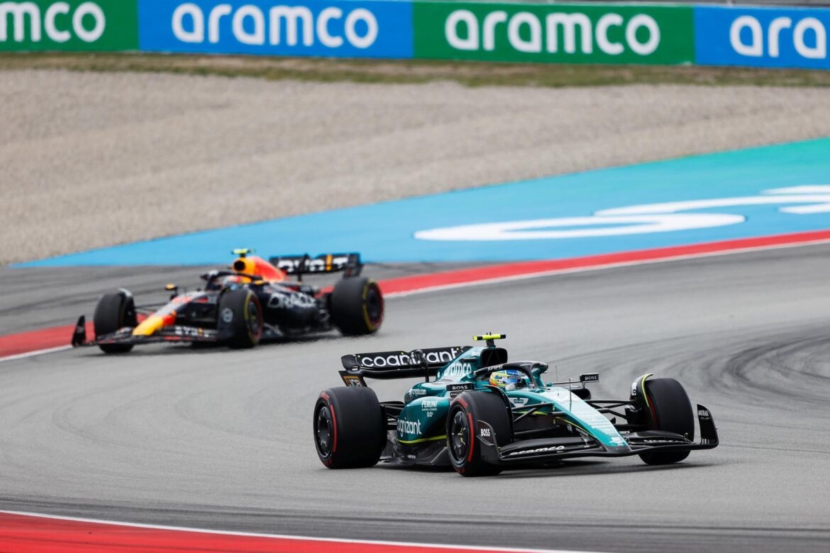 Fernando Alonso, Aston Martin AMR23, leads Sergio Perez, Red Bull Racing RB19